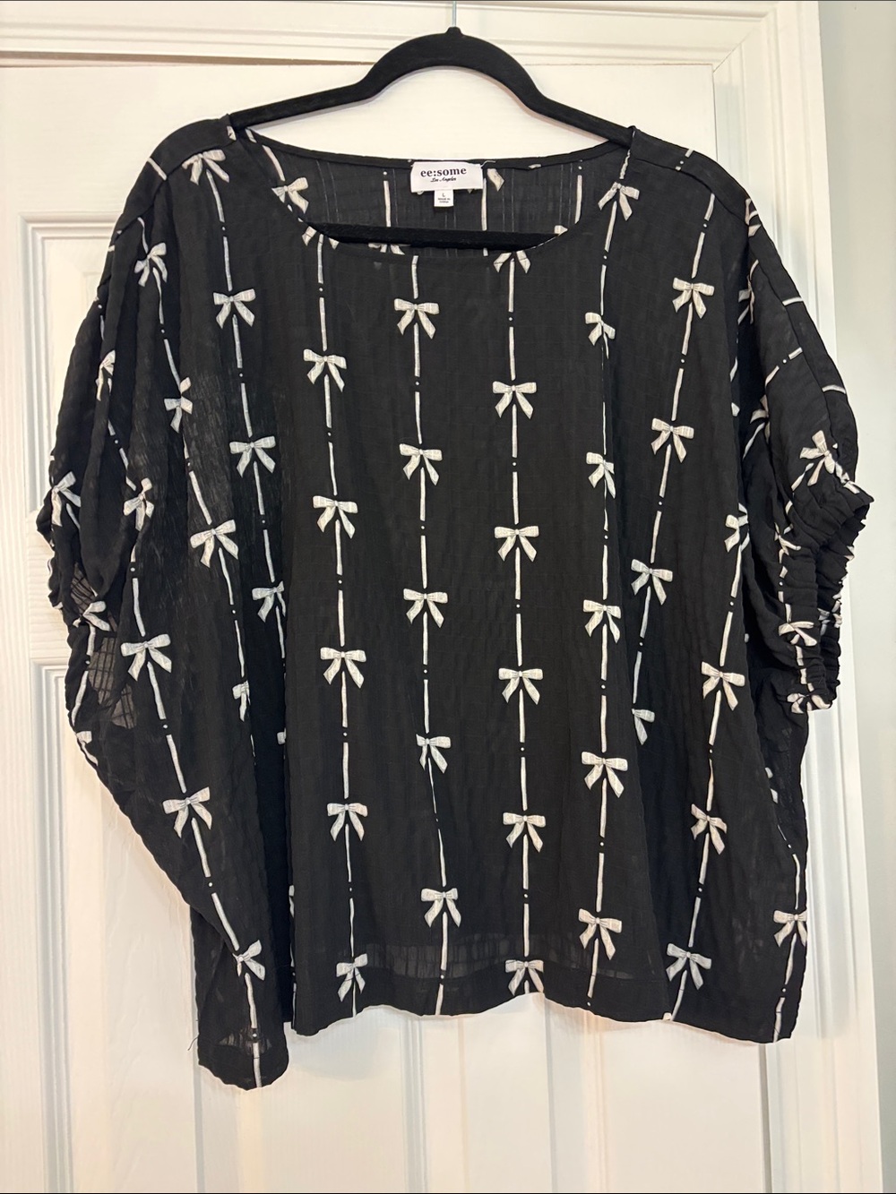 eesome Black Semi-Sheer Bow-Print Blouse